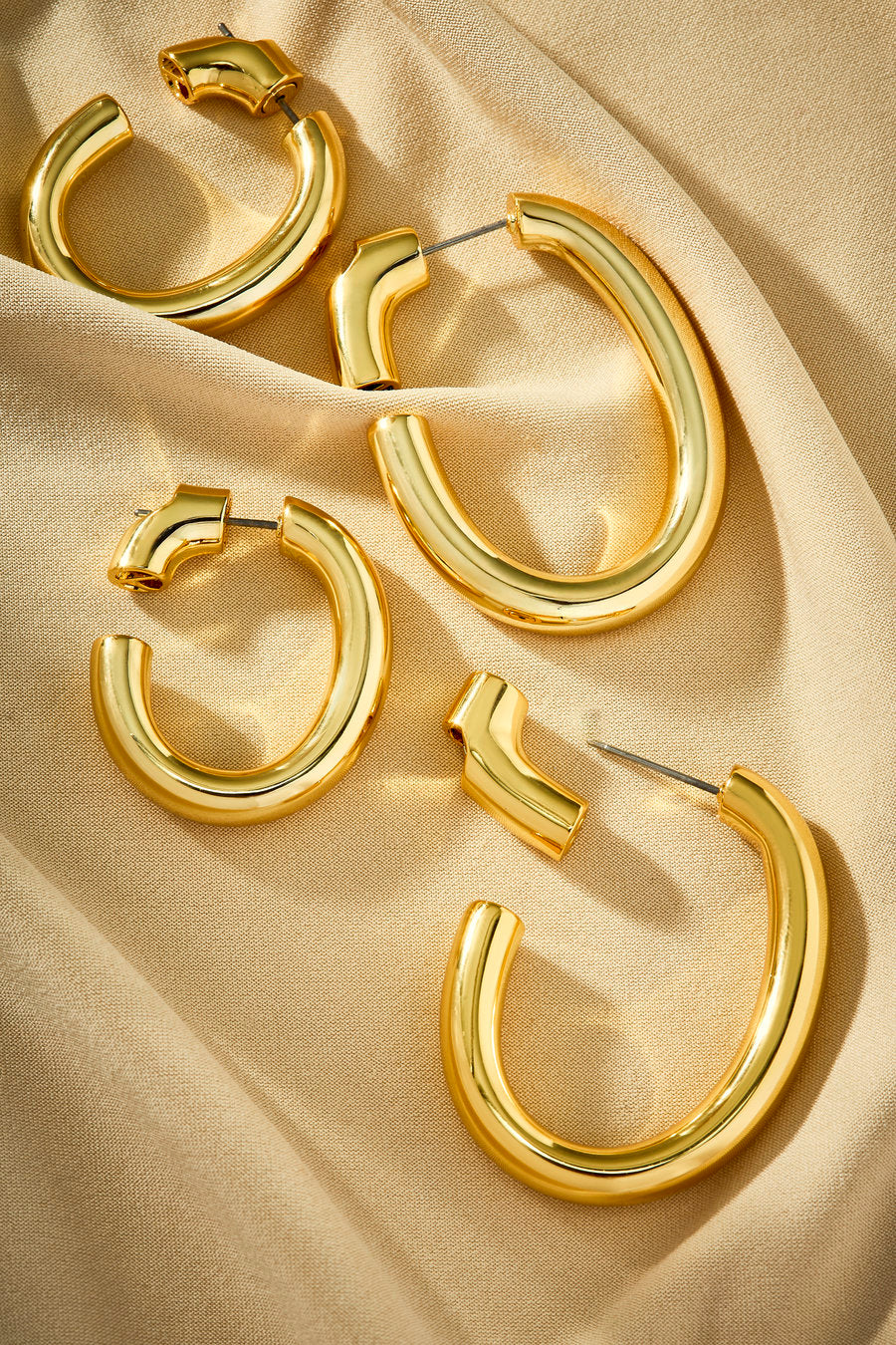 Gold Memory Hoop Earrings with a continuous organic design and polished volume.