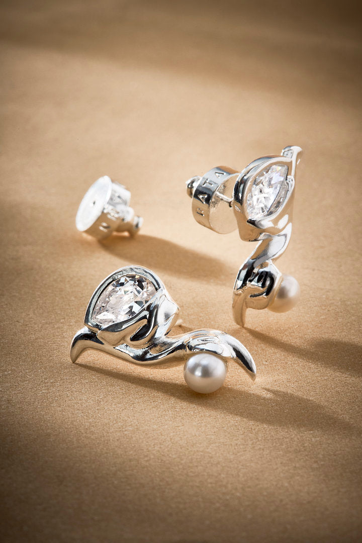 Audrey silver earring featuring a pearl, Austrian crystal, and soft curves. A classic, timeless piece for elegant, feminine looks.