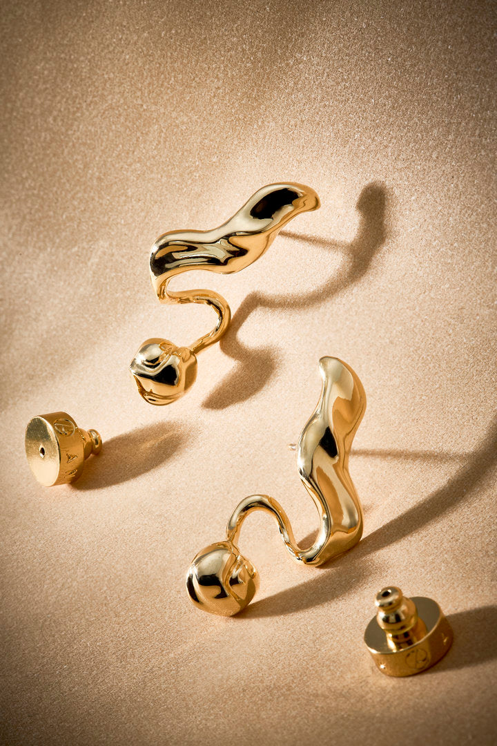 Gold Frida earring with fluid shapes — a statement piece for elegant looks.