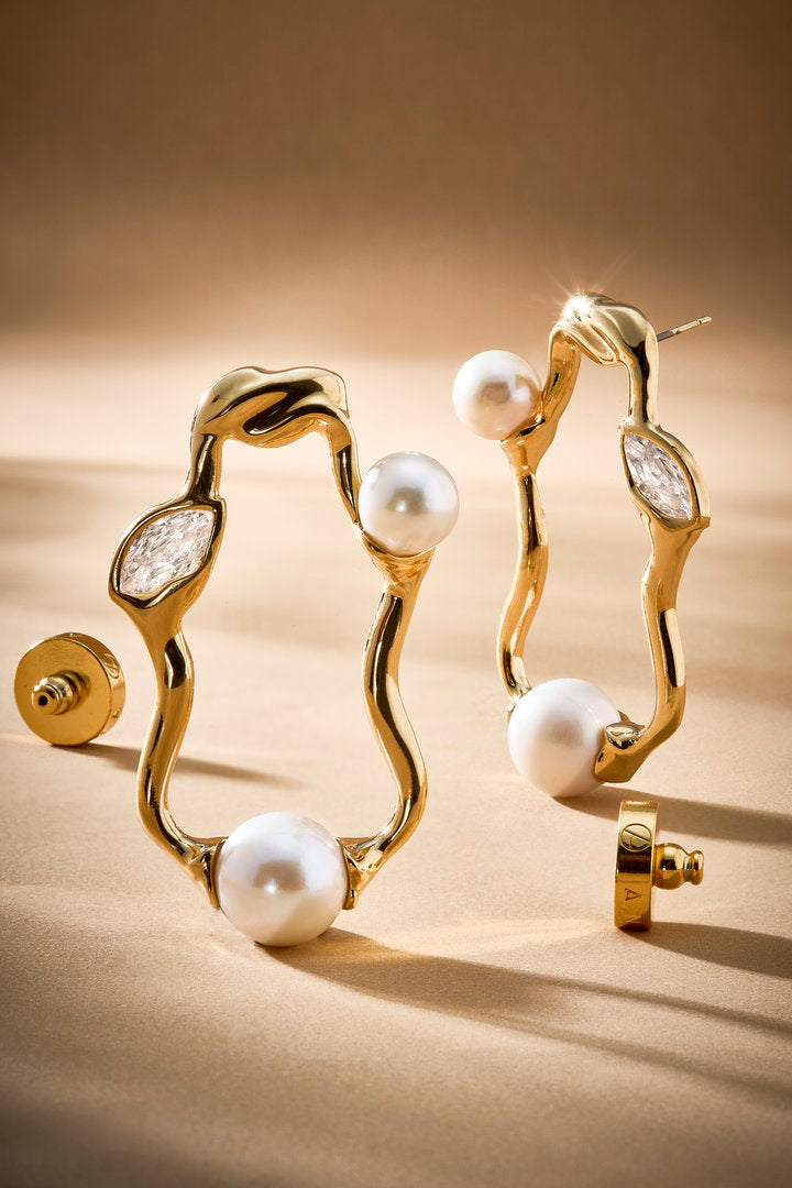 Gold Gabrielle earring with pearls and Austrian crystals — a sculptural piece of jewelry for sophisticated occasions.