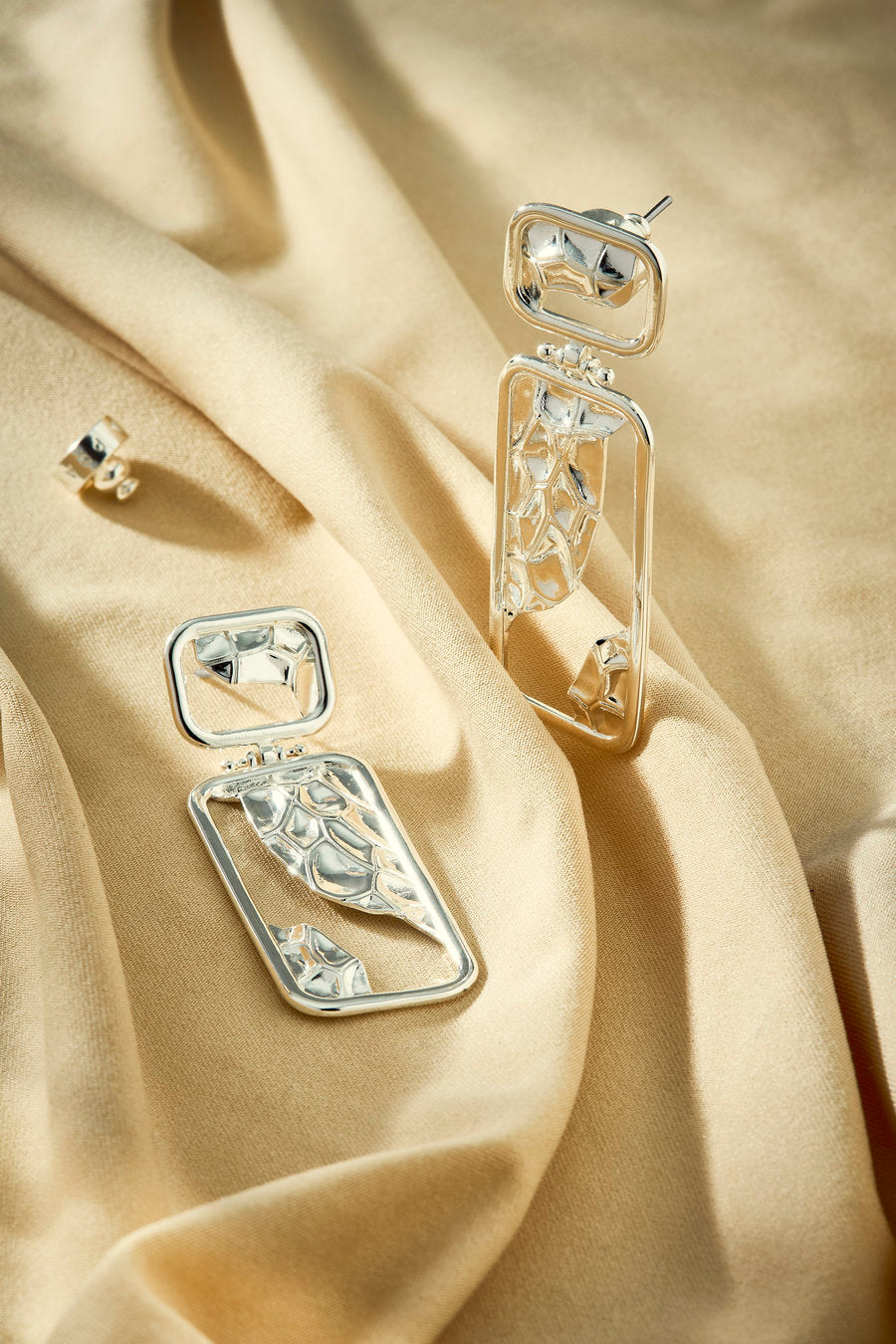 Era women's silver earring with a contemporary look.