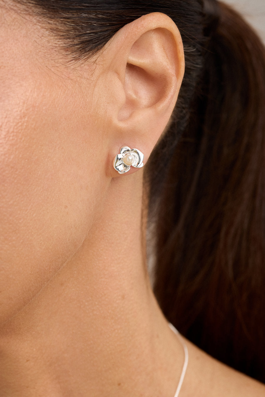 Gold-toned Bloom earrings with a sculptural floral design and a delicate central detail, ideal for gifting with elegance.