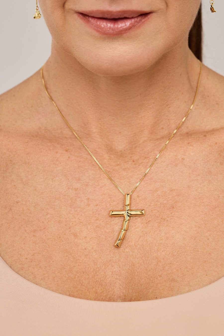 Gold-toned Redemption necklace with a contemporary cross in a polished finish, ideal for gifting with faith, meaning, and sophistication.