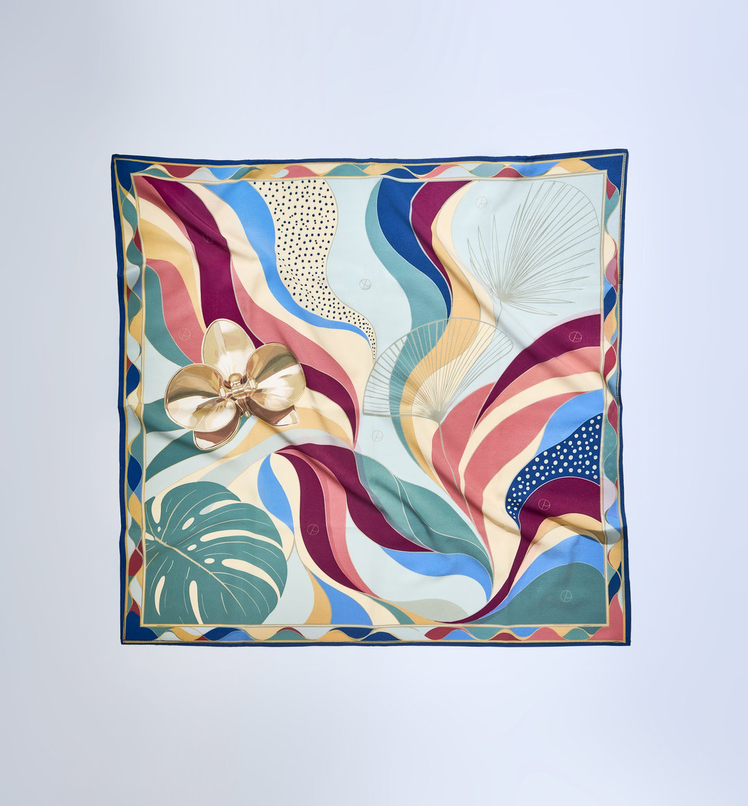 A square silk scarf featuring a vibrant tropical and abstract design, laid flat against a light gray background. The pattern includes a large gold orchid flower, a green monstera leaf, and flowing wavy stripes in shades of blue, teal, pink, burgundy, and beige, framed by a dark blue border.