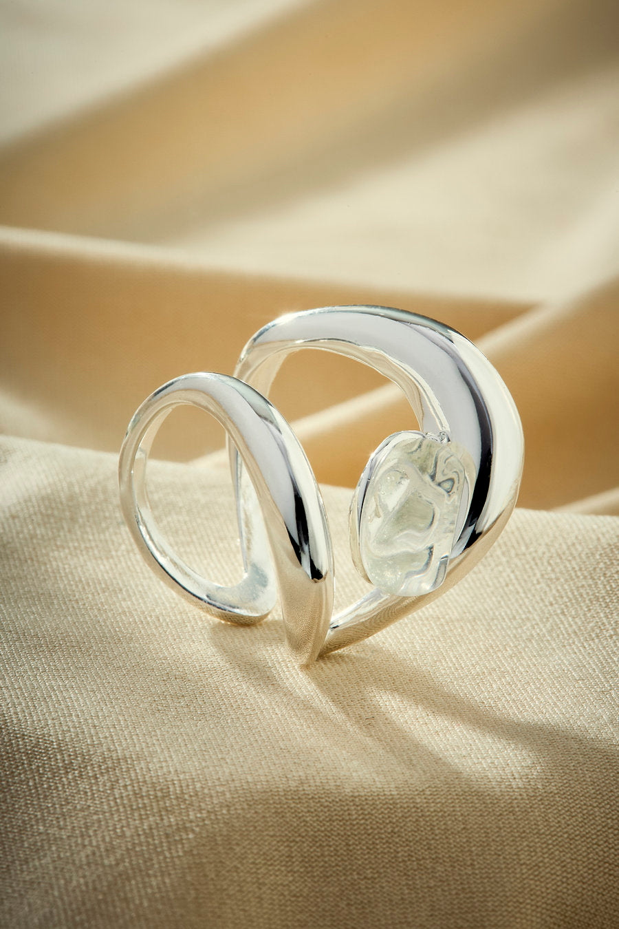 Silver gift ring with crystal and sculptural organic design.
