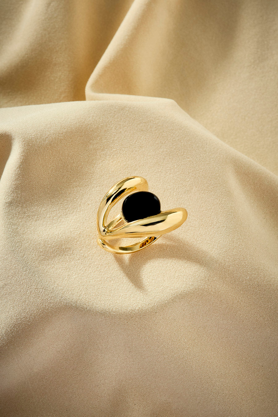 Designer gold ring with onyx and a contemporary look.
