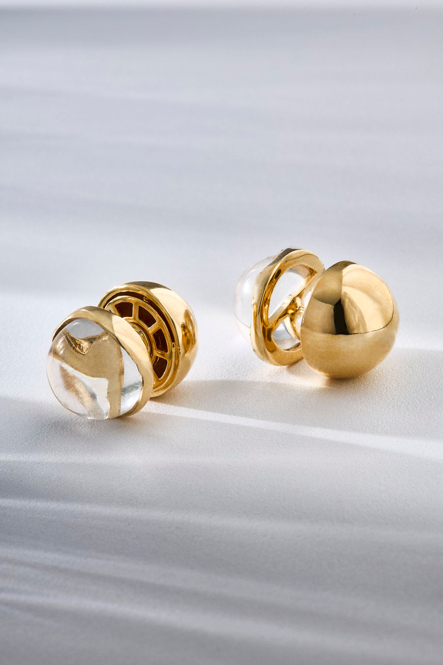 Gold-toned Crystal Duo earrings with stone and metal in perfect balance, representing two complementary shapes in a piece of sentimental and timeless inspiration.