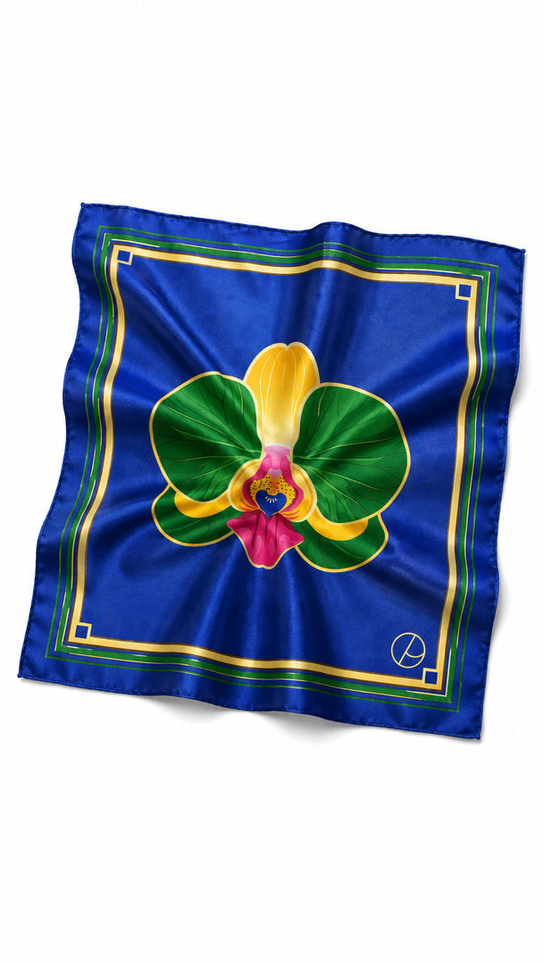 Tropical floral scarf in shades of blue, green and gold, inspired by the rare beauty of orchids.